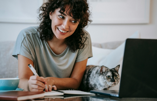 happy woman writing down notes