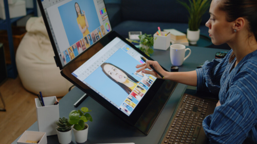 a girl editing an image on her screen